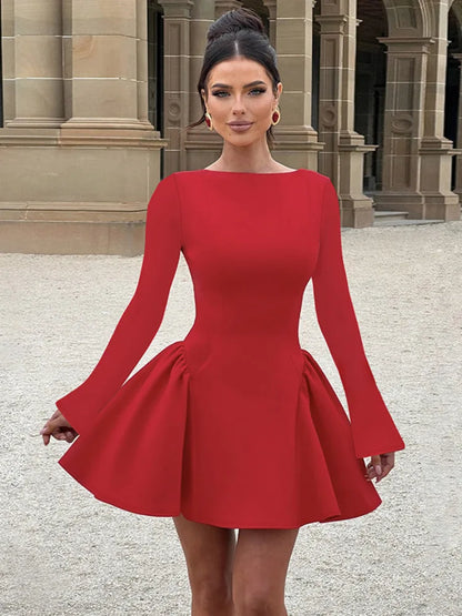 Woman wearing a red long-sleeved mini dress with an O-neck, high-waist A-line silhouette, bodycon fit, and a flowy skirt,