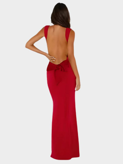 Woman wearing a red sleeveless Bodycon Maxi Dress with a Backless Design and a Satin Bow