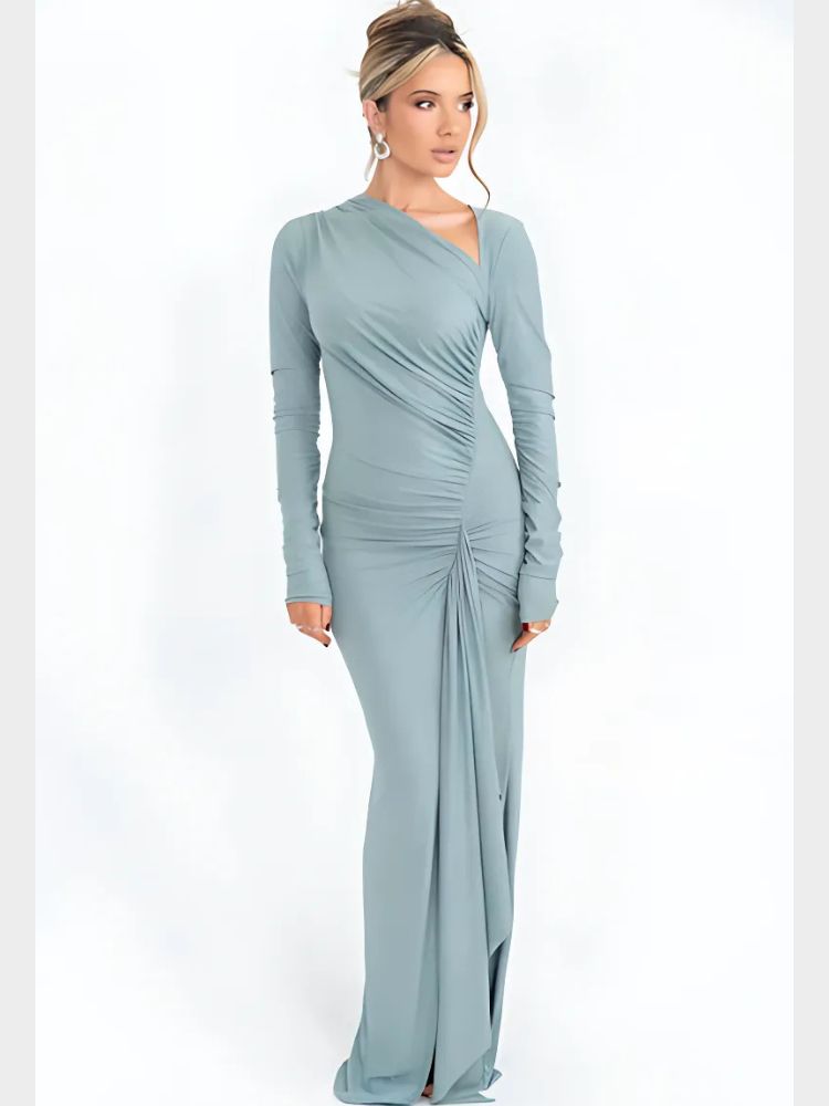 Woman wearing a sparkly light blue asymmetrical maxi dress with long sleeves, ruched details, and a draped hemline.