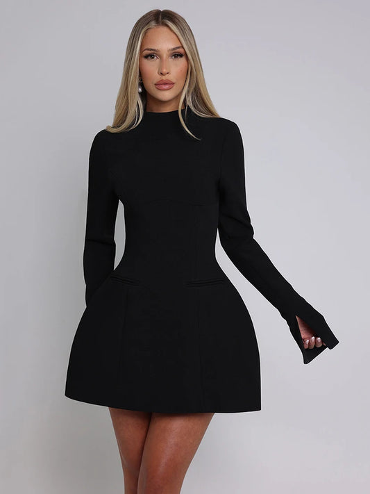 Woman wearng a black long sleeve backless mini dress with an O-neck, high waist, and A-line skirt