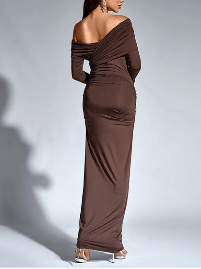 Woman wearing a brown bodycon maxi dress with long sleeve, asymmetric neck, one shoulder, and ruched detailing