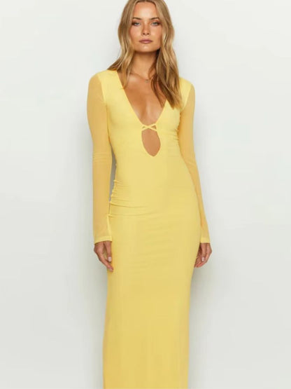 Woman wearing a yellow Maxi Dress, hollow-out bodycon, sheer mesh long sleeves, lace-up design, reversible wear.