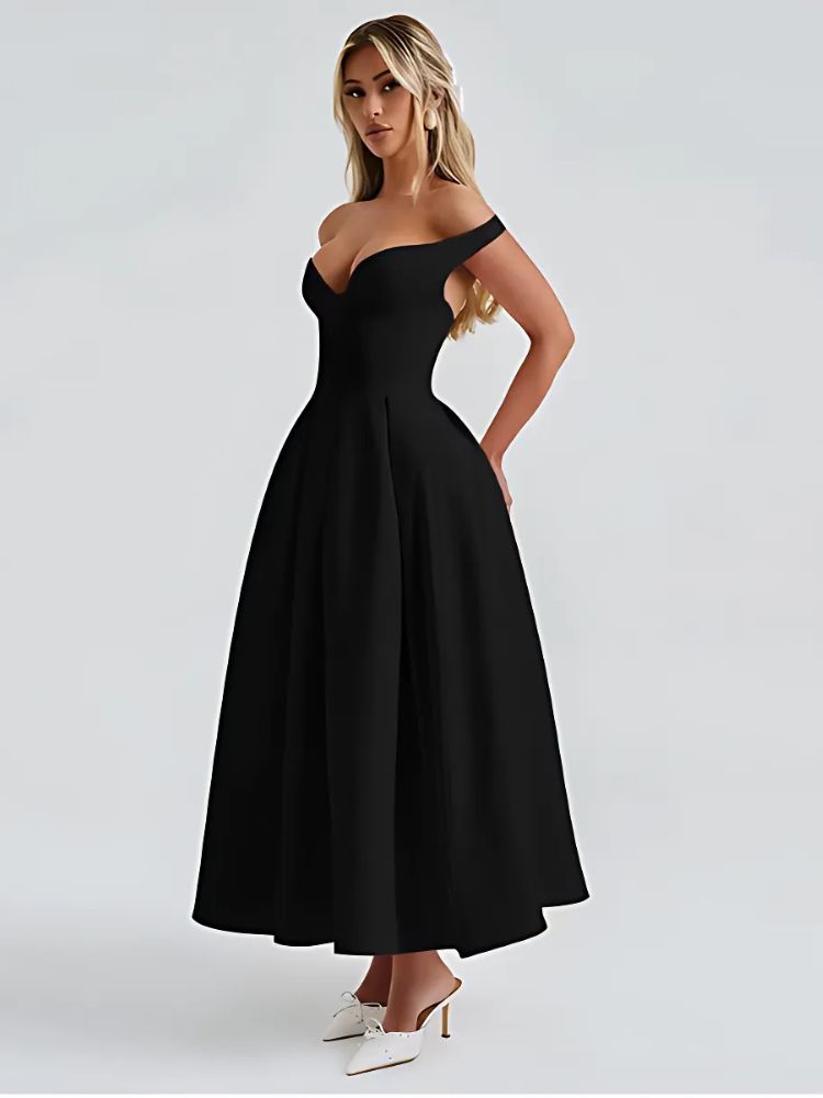 A woman wearing a Black off shoulder midaxi dress with a pleated skirt