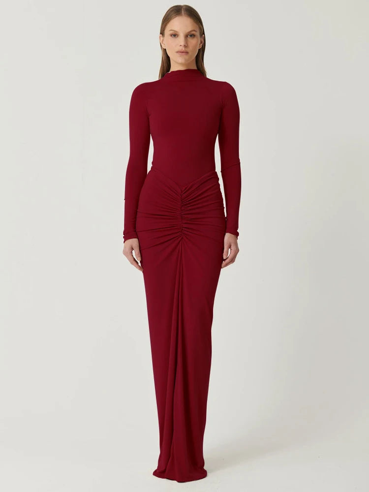 Woman wearing a red Floor-length bodycon dress with long sleeves, high collar, O-neck, high waist, pleated hip detail, and invisible zipper