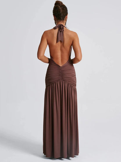 Brown sleeveless maxi dress with a deep V-neckline, backless design, and a thigh-high split.