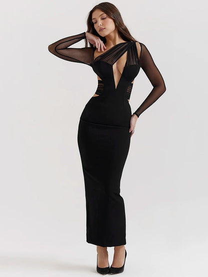 Black bodycon maxi dress with sheer long sleeves and hollow-out details.