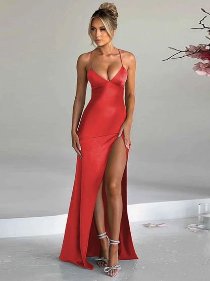 Red satin bodycon maxi dress with a thigh-high split, slight stretch, and sheath silhouette. Features a strapless V-neckline, spaghetti straps, and a backless design