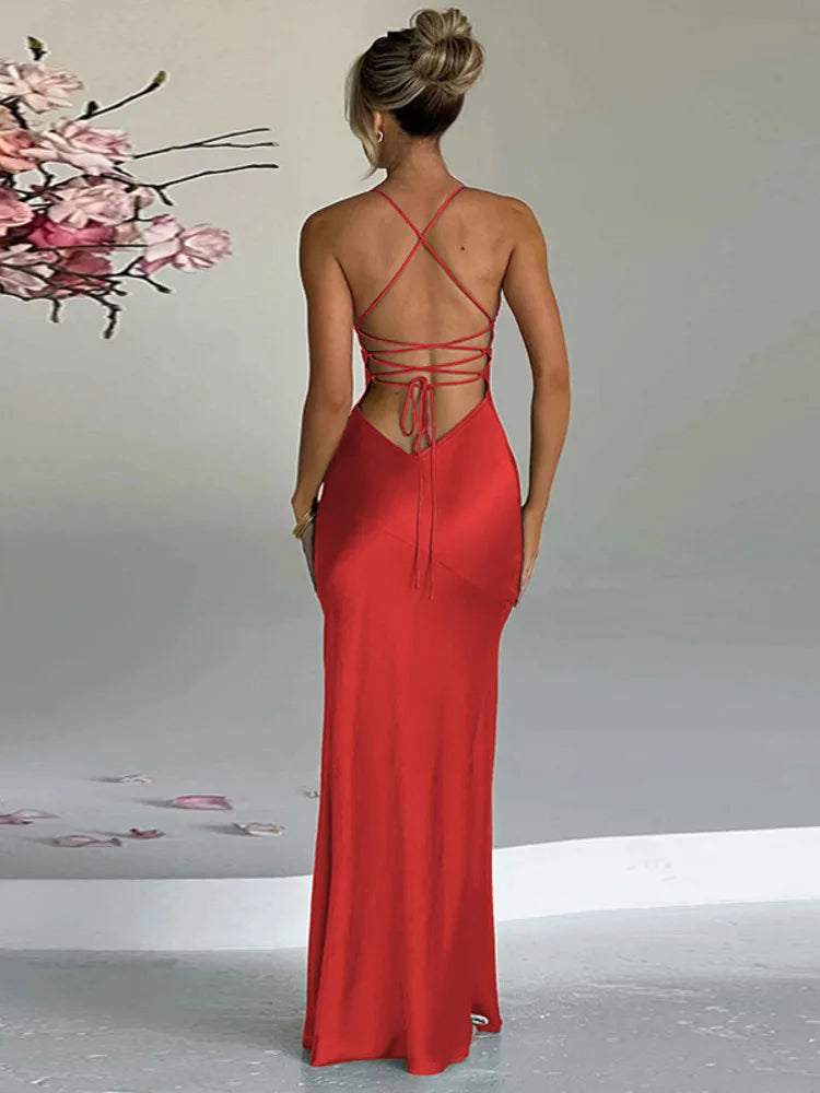 Red satin bodycon maxi dress with a thigh-high split, slight stretch, and sheath silhouette. Features a strapless V-neckline, spaghetti straps, and a backless design