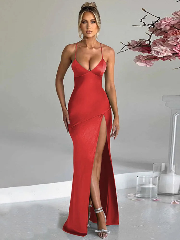 Red satin bodycon maxi dress with a thigh-high split, slight stretch, and sheath silhouette. Features a strapless V-neckline, spaghetti straps, and a backless design