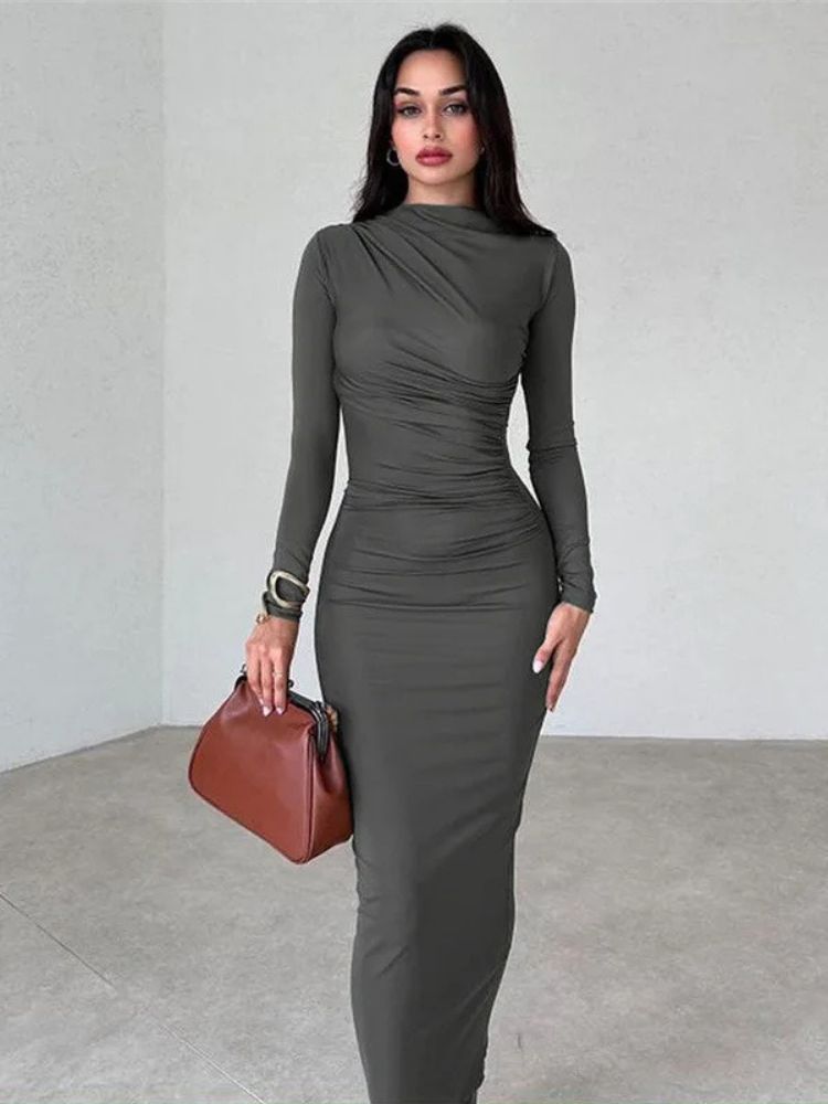 Woman wearing a dark grey ruched bodycon maxi dress with long sleeves, O-neck, and ankle-length design