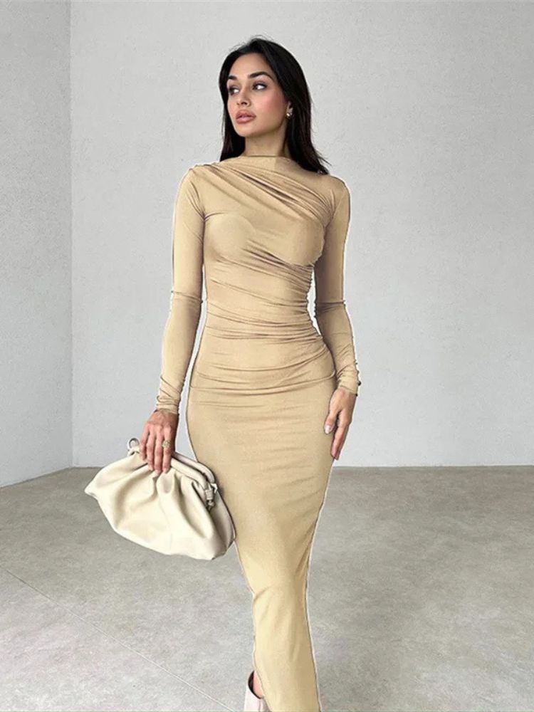 Woman wearing a khaki colour ruched bodycon maxi dress with long sleeves, O-neck, and ankle-length design