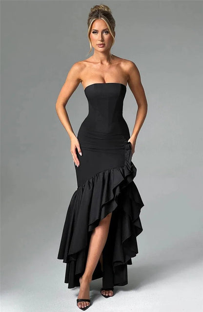 Black bodycon long dress with a high split ruffle skirt, sleeveless design, and off-shoulder neckline.